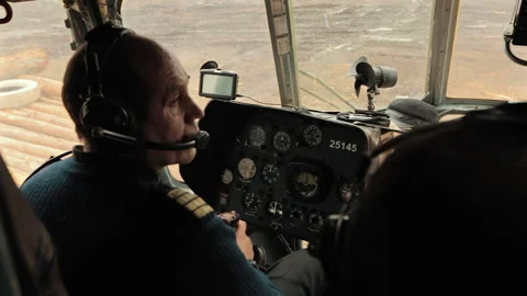 Crew of a Russian transport helicopter is preparing to take off in the cockpit. Stock Footage 245168049