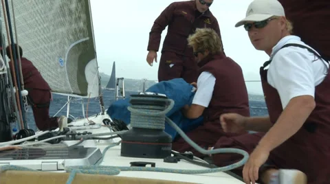 Crew of sailing boat maneuvering during regatta Stock Footage