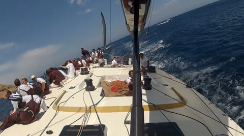 Crew of sailing boat standing on the side of the boat during regatta Stock Footage 36176647