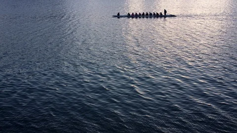 A Crew Team Rows at Dusk Stock Footage 108130456