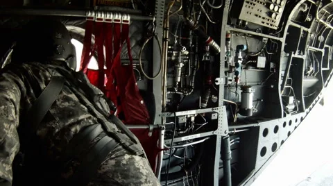The crew throws duffle bags out the back hatch and gather the straps. Stockbeeldmateriaal 52703968