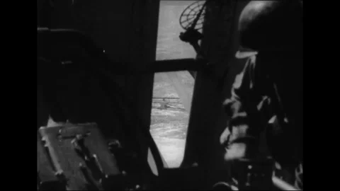 Crewman load shells; Japanese plane explodes in air, fragments hit water - 1944 動画素材 102845124