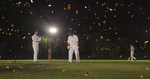 Cricket batsman hitting, swing causing gold confetti fall, keeper shifting, Stock Footage 323335180