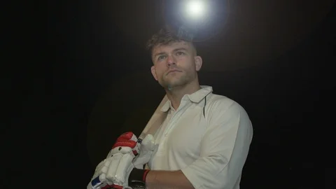 Cricket / Cricketer Portrait with the bat. Black Background. Super slow motion. Stock Footage 125980219