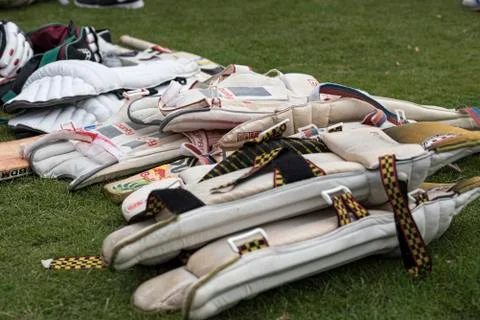 Cricket equipment piled up ready for use at a local charity cricket match Stock Photos