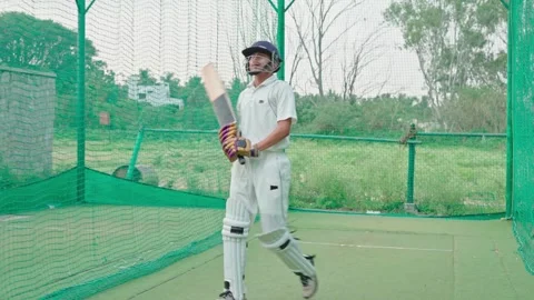Cricket player doing warmup before the match starts in nets Stock Footage 251644426