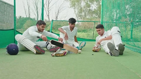 Cricket player having chit chat with their teammates after having net practice Stock Footage 251645025