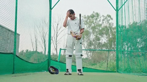 Cricket player is tired after having hard training or practice in nets Stock Footage 251644729