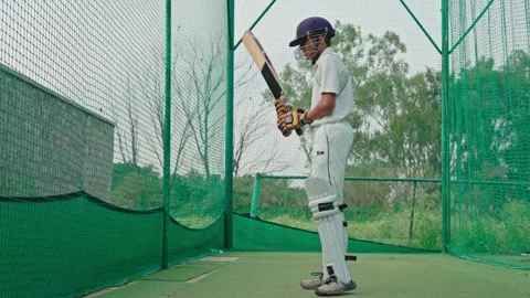 Cricket player wearing kit during his match time to play well in the game Stock Footage 251645268