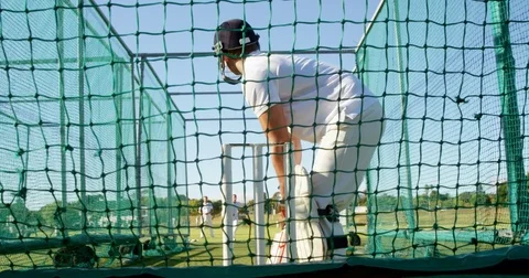 Cricket players practicing in the nets during a practice session Stock Footage 78637641