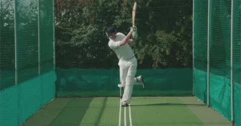 Cricketer hits a great shot in nets. Vídeo Stock 58841477