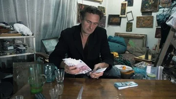 Crime and danger. The man in the dark room and counts the money. 4K Video stock 85668331