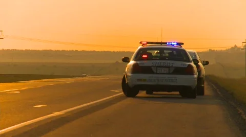 Crime and justice, police, early morning, speeder pulled over by police Stock Footage