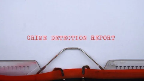 Crime detection report - phrase printed on an old typewriter in red letters Stock-Footage 128400616