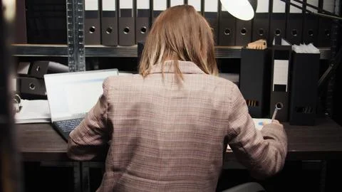 Crime expert analyzing forensic records Stock Photos