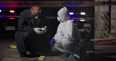 Crime scene, detective and forensic team in discussion with evidence, ppe or Stock Footage 279867969