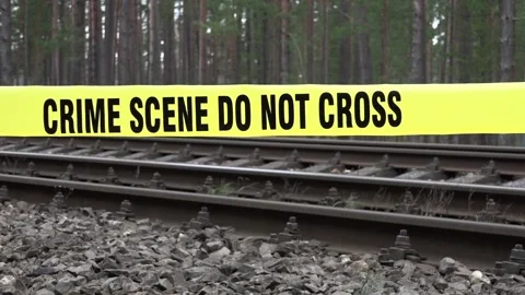 Crime Scene Do Not Cross over railroad tracks Stock Footage 239641492