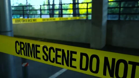 Crime Scene Do Not Cross Tape at an Underground Parking Garage Stock Footage 337496107