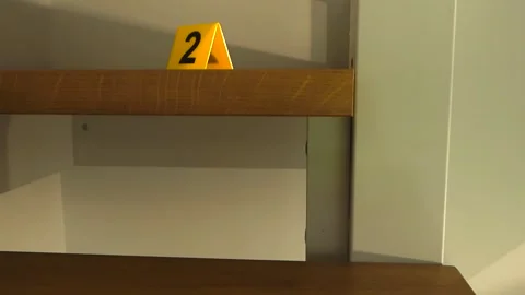 Crime scene evidence markers placed on wooden stairs Stock Footage 344103436