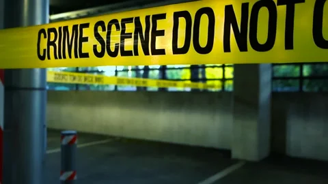 Crime scene tape blocking access to underground parking garage Stock Footage 336954489