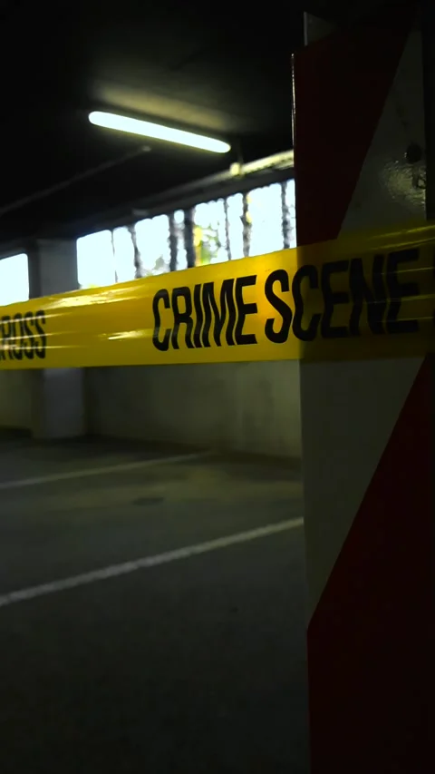 Crime scene tape cordoning off an underground parking garage Stock Footage 336957749