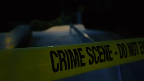 Crime scene tape pulled in front of a skatepark during night time with bokeh Vídeos de archivo 313119324