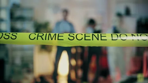 Crime scene tape securing perimeter, detectives conducting murder investigation Stock Footage 189470701