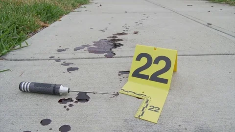 CRIME SCENE WITH A WEAPON AND EVIDENCE MARKER. A SERIES. Stock Footage