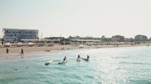 Crimea, August 12, 2022: Sup yoga, aerial view of group well looking middle aged Stock Footage 216549952