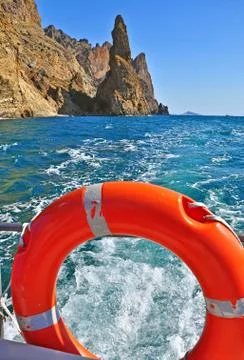 Crimea. View of the rock Ivan-robber Karadagsky reserve from stern of a boat. Stock Photos