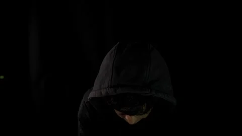 Criminal with black hood preparing to attack Stock-Footage 275360826