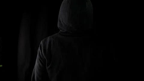 Criminal with black hood preparing to attack Video stock 275360988