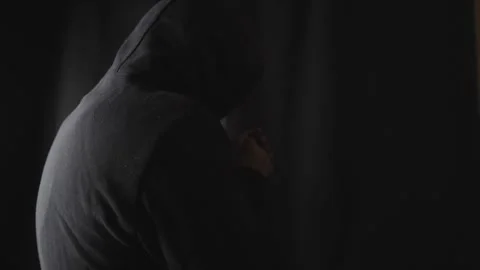 Criminal with black hood preparing to attack Video stock 275361163