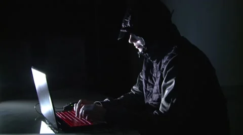 The criminal breaks the network. Theft of personal data from the computer. 動画素材 58751115