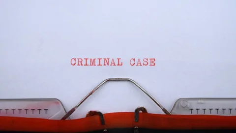 Criminal case - phrase printed on an old typewriter in red letters, close up. Video stock 128400670
