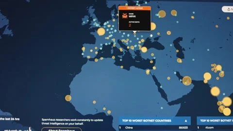 Criminal Hacker using computer pointing to a world map for organizing global Stock Footage 249650372