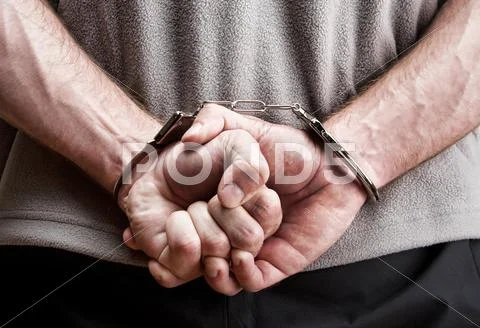 Criminal in handcuffs Stock Photos