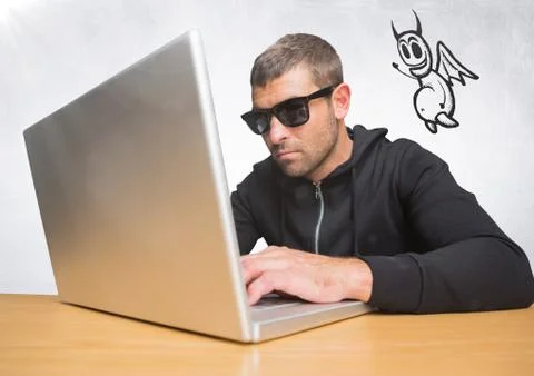 Criminal on laptop with devil icon floating alongside Foto stock