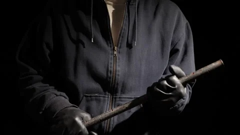A criminal man about to attack with an Iron bar Video stock 221373646