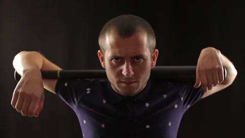 Criminal man looking at camera with baseball bat Stock Footage 82919349