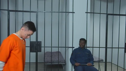 A criminal in prison is released from handcuffs Stock Footage 128366958
