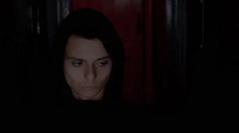 Criminal programmer in hood cracking code using computers in dark room Stock Footage 68908022