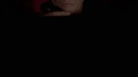 Criminal programmer in hood using VR glasses in dark room close up Video stock 68916253