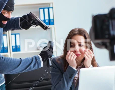 Criminal recording message for ransom with victim businesswoman Stock Photos