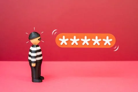A criminal trying to guess a security password. Concept of cybercrime and hac Stock Photos