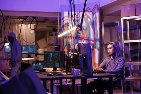 Criminal using computer to hack system 스톡 사진