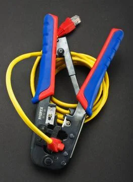 Crimping process with specialized professional tool Stock Photos