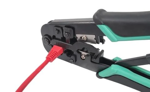 Crimping tool with a network cable isolated Stock Photos