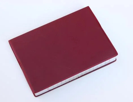 Crimson notebook on white background Stock Photos