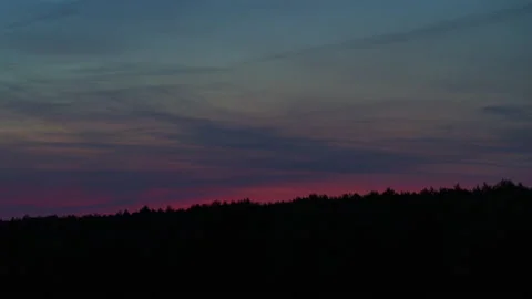 Crimson sunset with feathery clouds Stock Footage 179955930